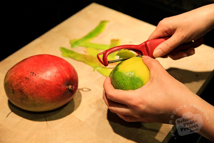 Haden mango, peeling mango, fruit peeler, fresh mango photos, tropical fruit photo, free stock photo, free picture, free image download, stock photography, stock images, royalty-free image